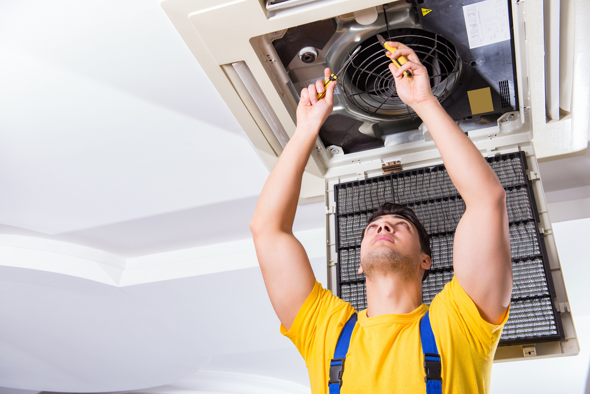 Man Repairing AC